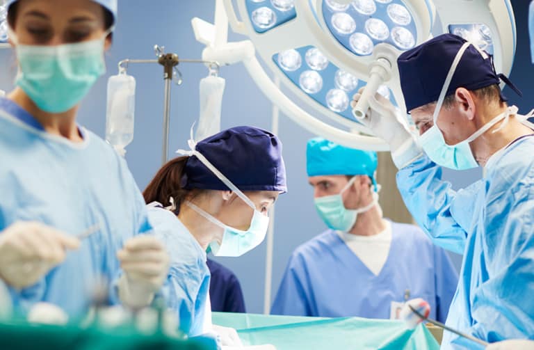 group-of-surgeons-in-operating-room-F4MNWBA