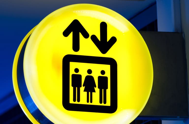 bright-yellow-lift-or-elevator-symbol-sign-on-blue-HVM4ZKB
